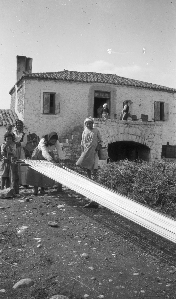 The dig house at Parapoungia for the Eutresis excavation. Dorothy Burr capturing her local friends weaving. ASCSA Archives, Dorothy Burr Thompson Photographic Collection.